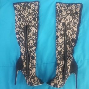 Thigh high lace boots.